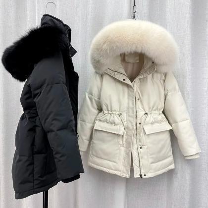 Sleek Ivory Snowfall Ready Parka With Fur Trim..