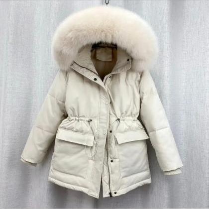 Sleek Ivory Snowfall Ready Parka With Fur Trim..