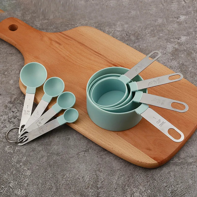 8-piece Stainless Steel Measuring Cups Set On Wooden Board