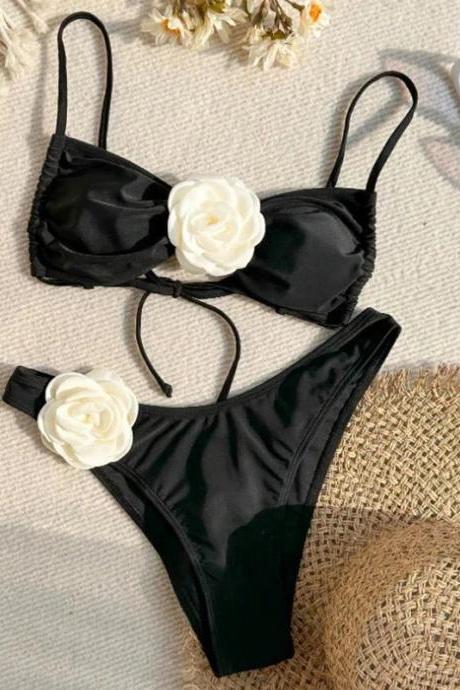Chic Black Two-piece Swimsuit With White Floral Accents