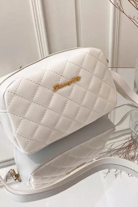 Elegant Quilted White Crossbody Purse With Gold Accents